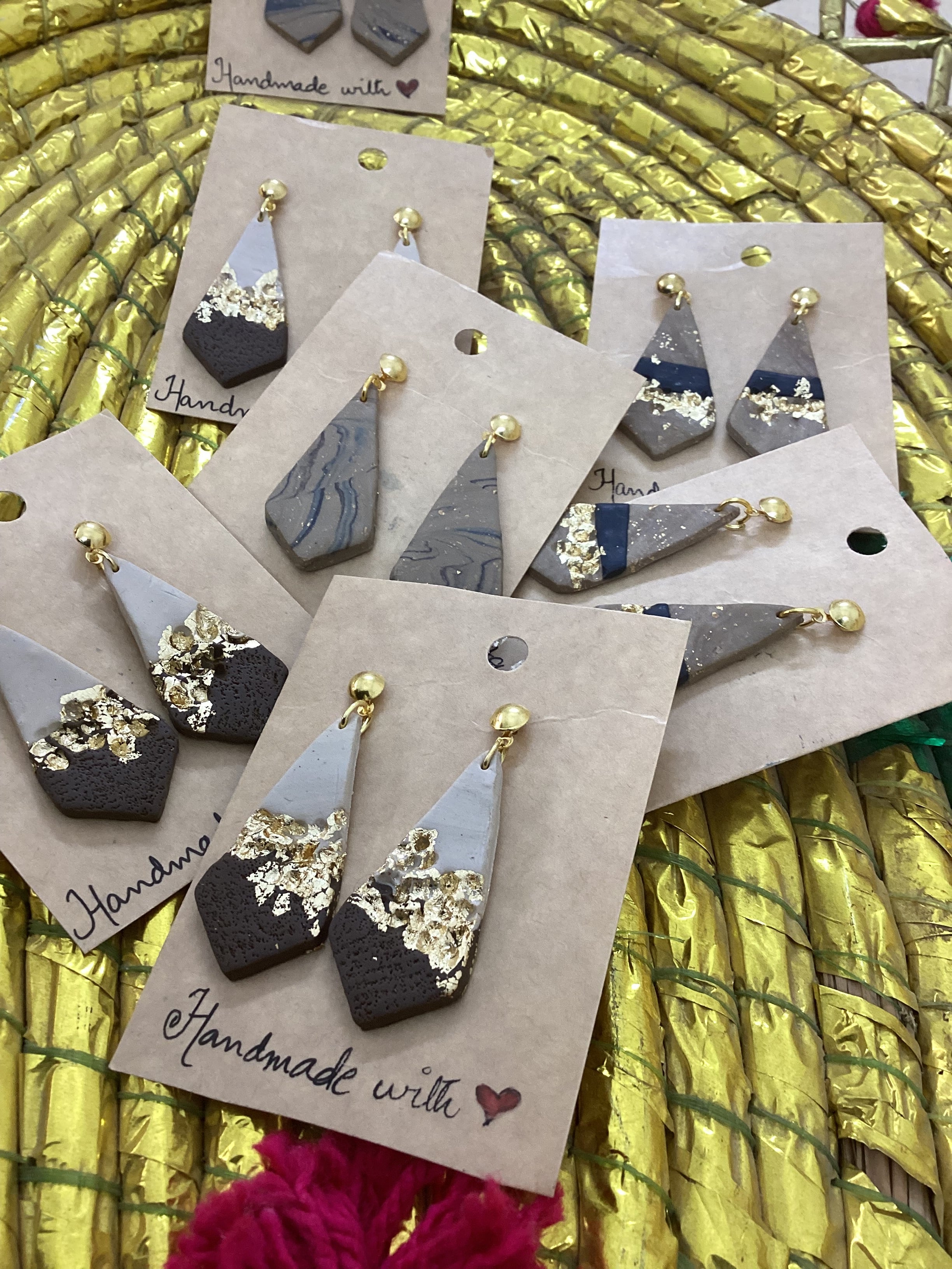 Tricon gold embedded earings