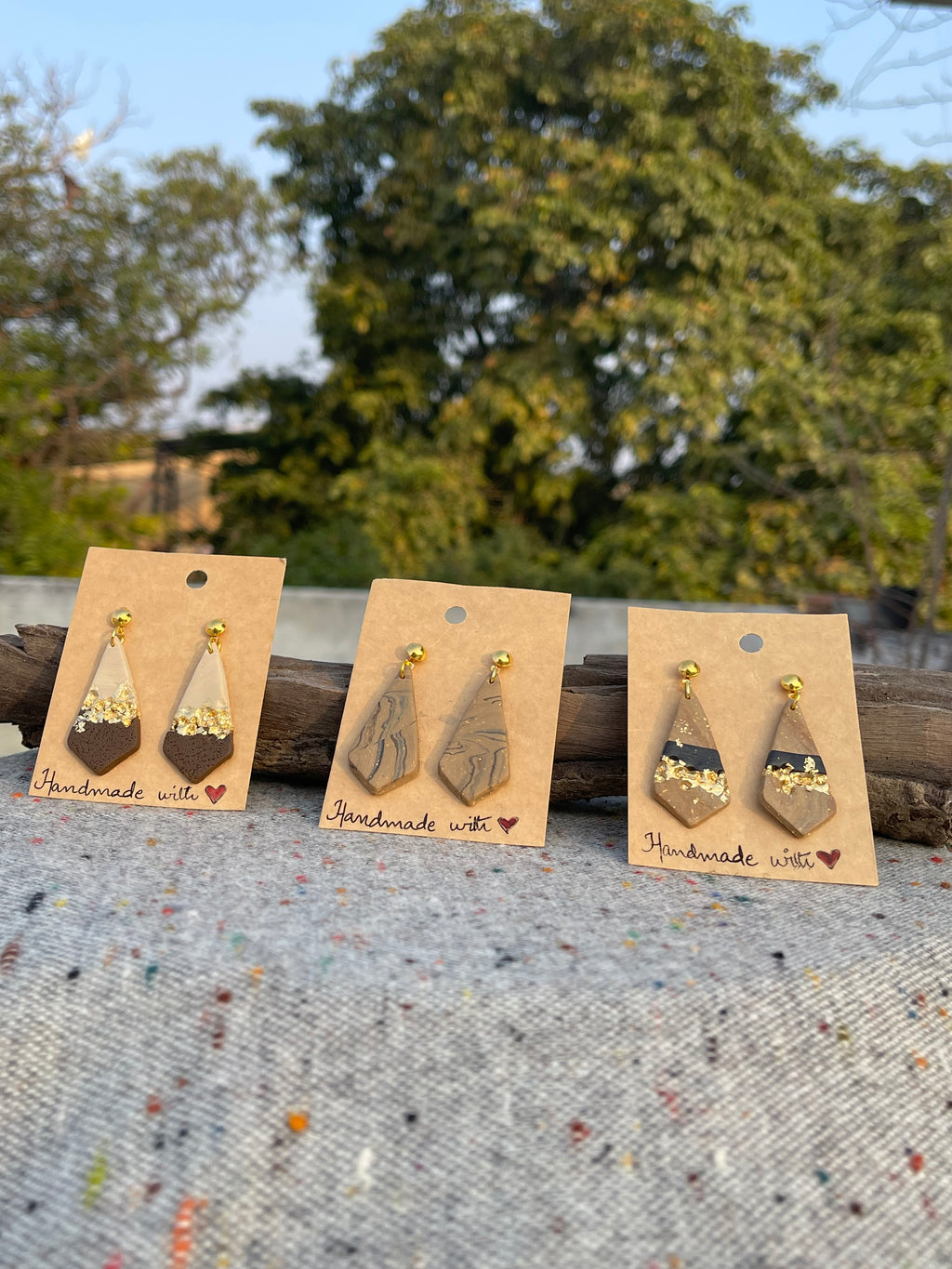 Tricon gold embedded earings