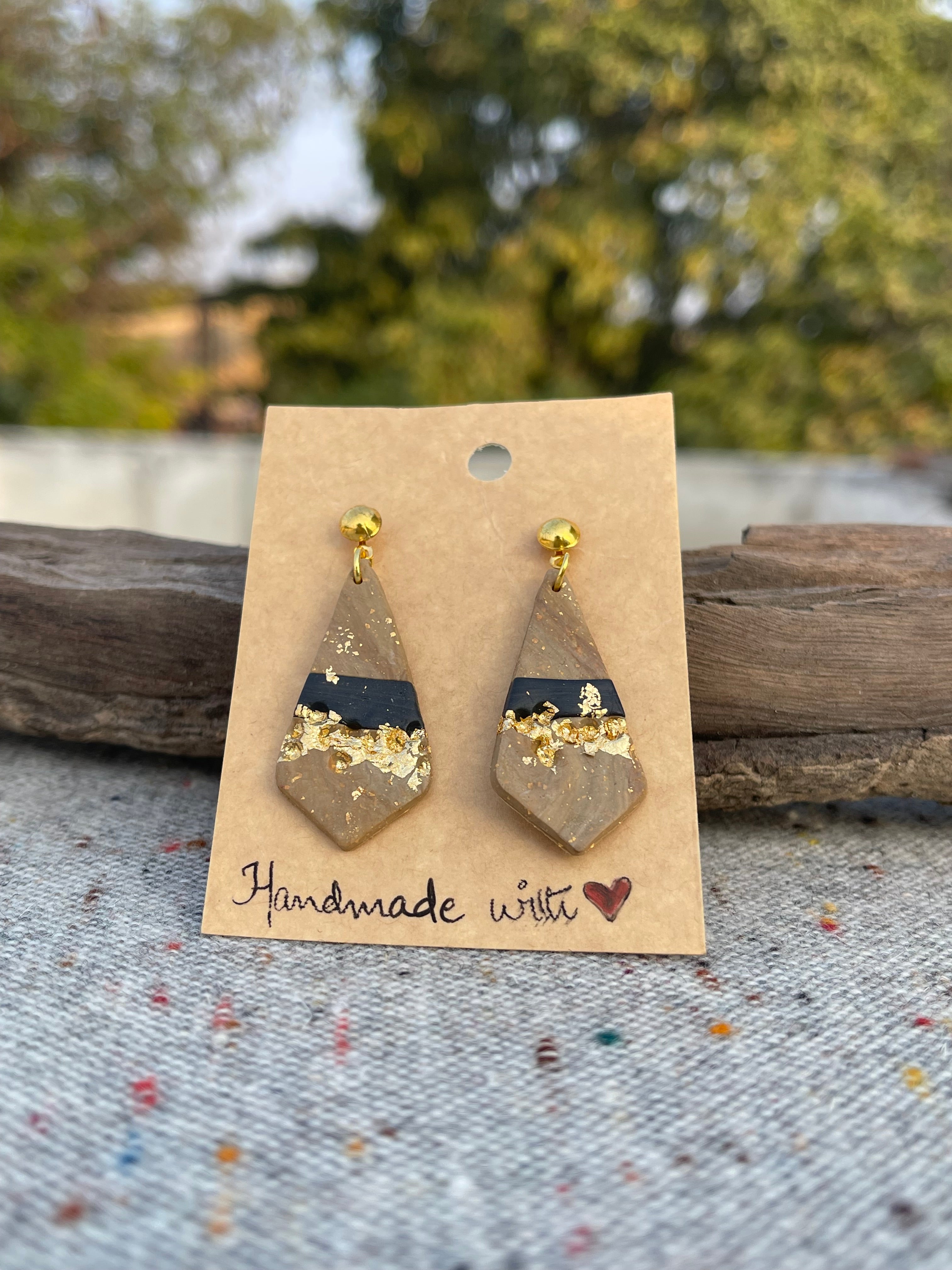 Tricon gold embedded earings