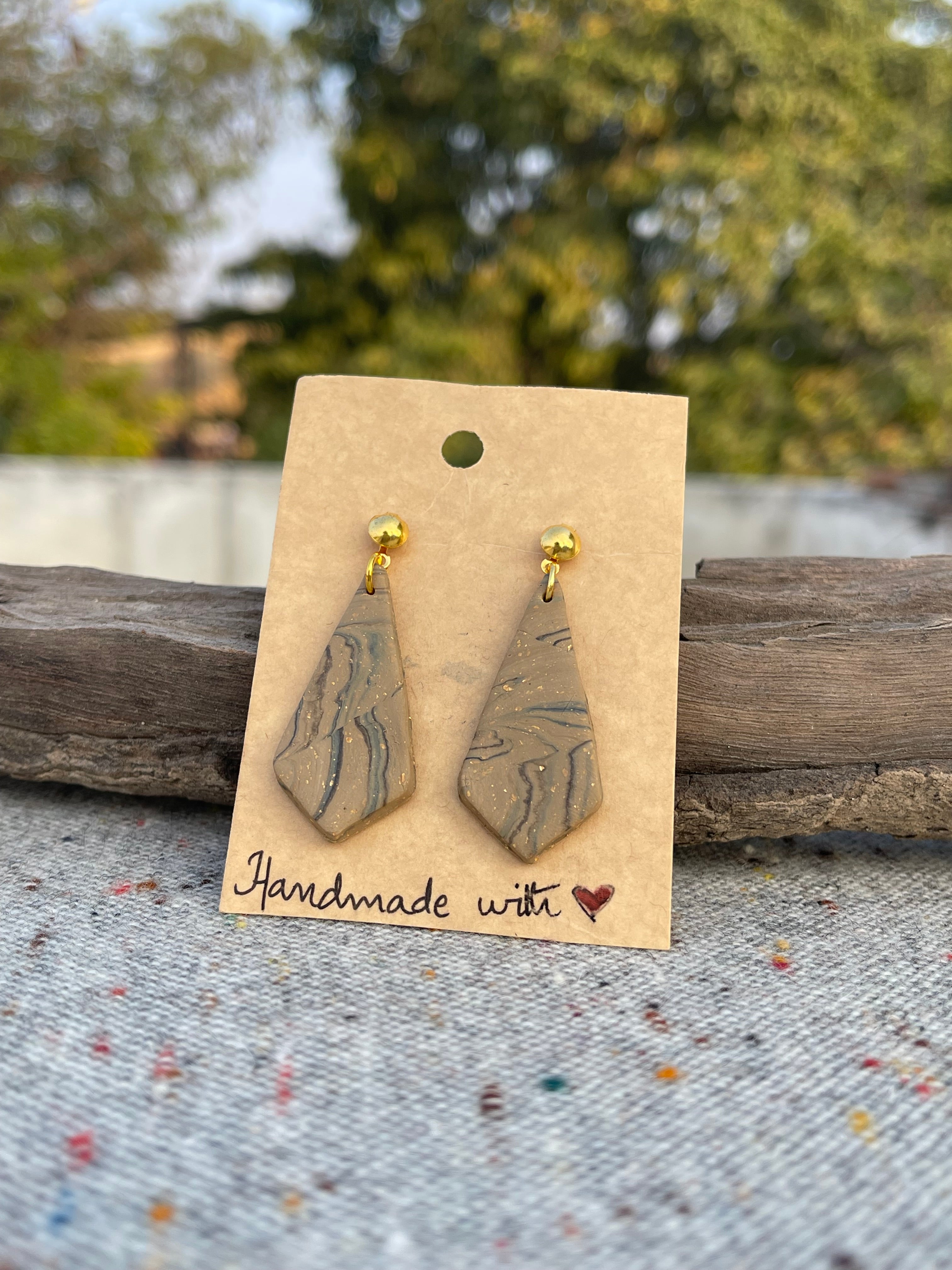 Tricon gold embedded earings